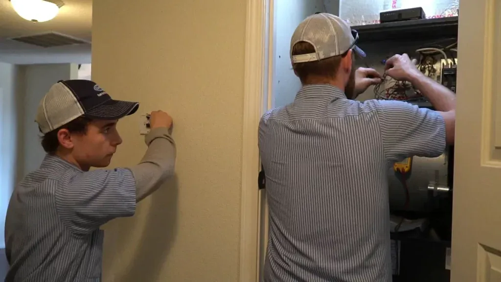 Climate Masters, Inc. technicians performing smart thermostat installation in Spanish Fort