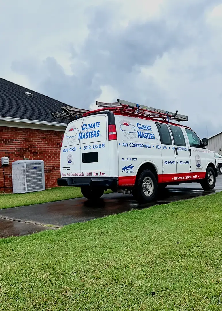 Climate Masters, Inc. work van for HVAC company Mobile County parked during residential service call