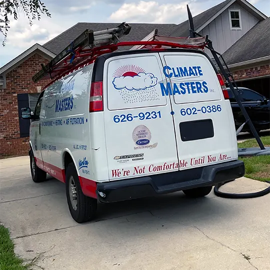 Work van in drive way of customers home | Climate Masters INC | HVAC Companies
