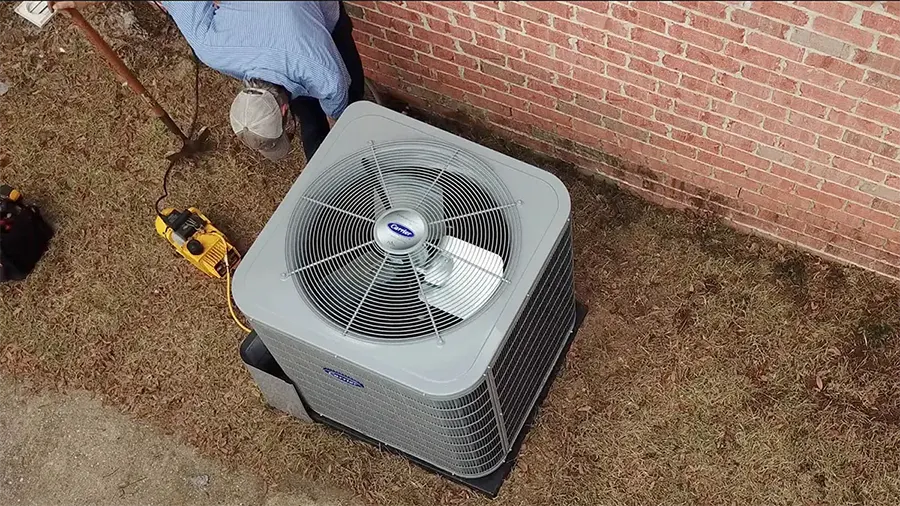 Climate Masters HVAC technician installing carrier unit. | 30850 Jay Dr. Spanish Fort, AL 36527 | Climate Masters INC Heating and Cooling